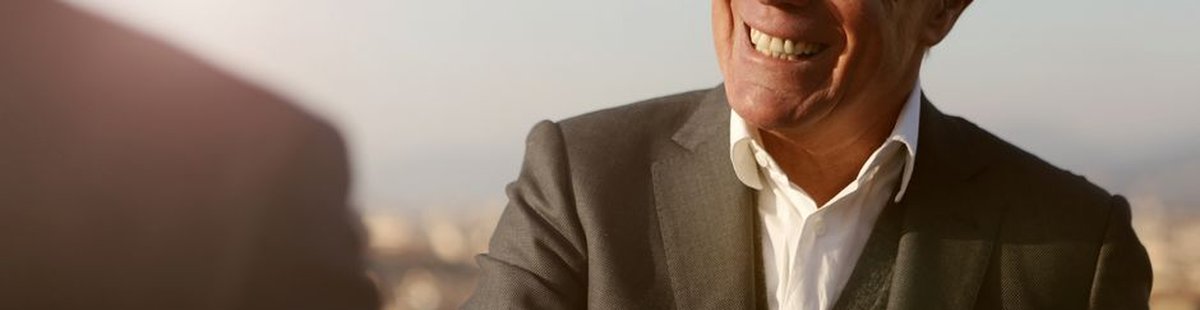 confident senior businessman smiling
