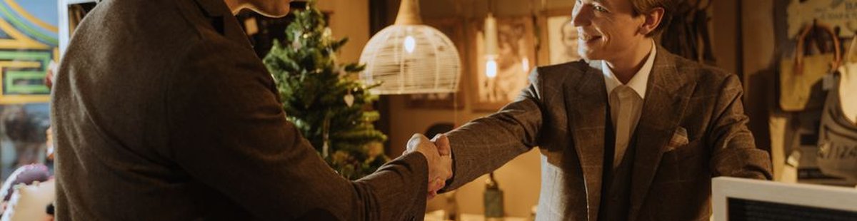 business handshake giving gift